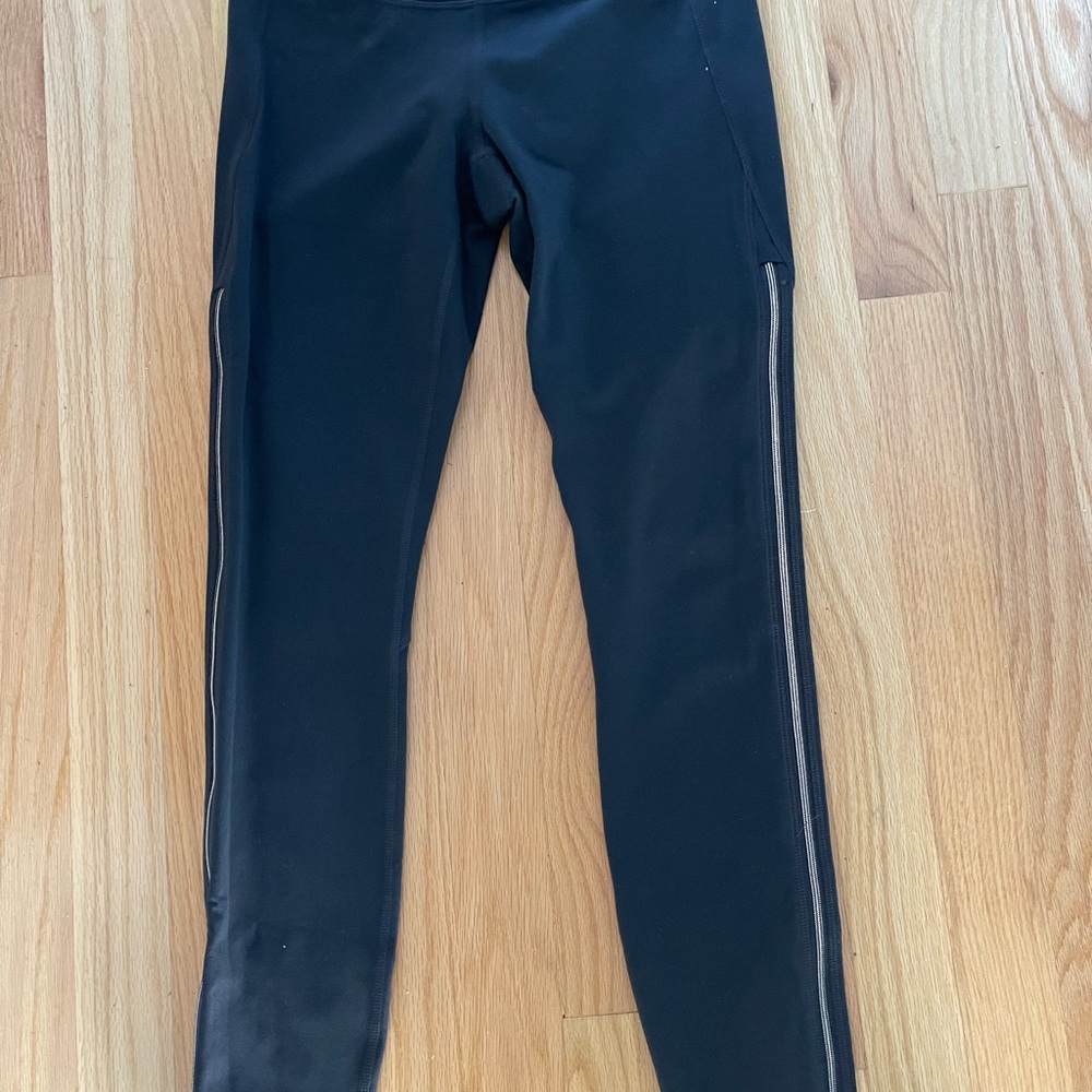 Athleta black legging with side leg rose gold zippers